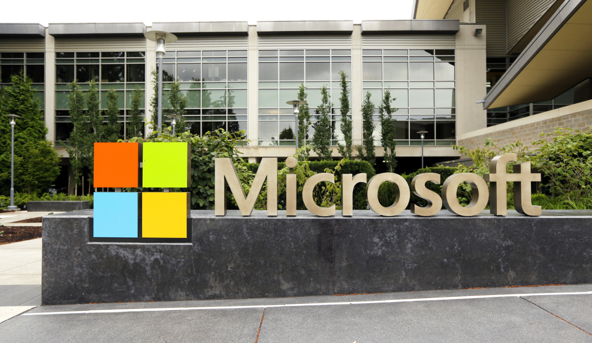 This photo taken July 3, 2014 shows the Microsoft Corp. logo outside the Microsoft Visitor Center in Redmond, Wash. (AP Photo Ted S. Warren) ORG XMIT: WATW202